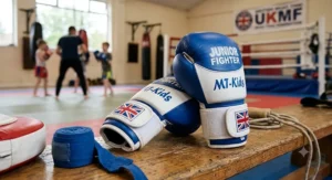 Small-sized junior Muay Thai gloves in blue and white, ideal for children's martial arts classes in the UK.