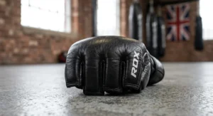 Close up of thick knuckle padding on an MMA glove designed for striking protection during mixed martial arts training in the UK.