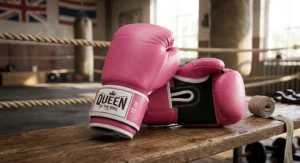 Pair of vibrant pink Muay Thai gloves designed for women's kickboxing and martial arts training.