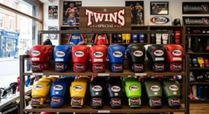 A selection of authentic Twins Special Muay Thai gloves on display for UK combat sports athletes