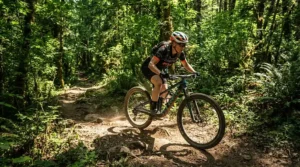 Breathable best budget MTB gloves being used on a dry summer woodland ride