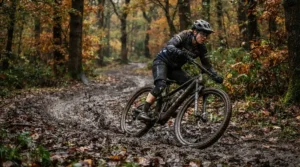 Sliding through a slick, muddy corner in a Welsh woodland while testing the best MTB gloves for downhill.
