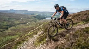 Hovering over a sheer drop-off in the Peak District, secured by the best MTB gloves for downhill.