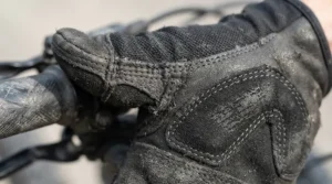 Durable enduro MTB gloves showing reinforced thumb panels after an intense day of riding