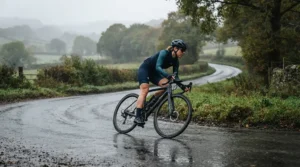 Female cyclist navigating damp country lanes in long finger road cycling gloves